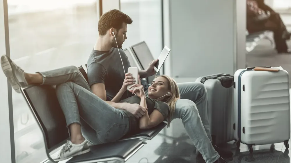 couple reading at airport